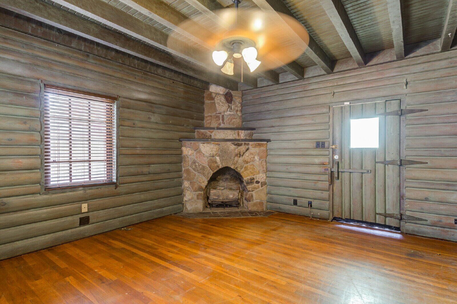 2305 18th Street, Unit FRONT Lubbock, TX 79401 - Photo 48 of 73 a room with a fireplace and wooden floor