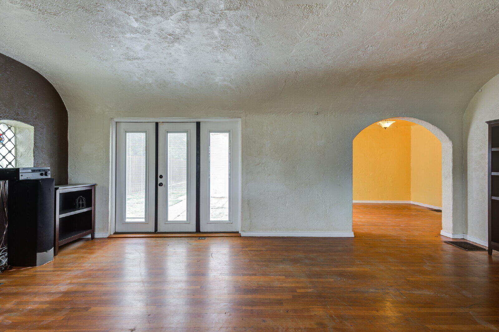 2305 18th Street, Unit FRONT Lubbock, TX 79401 - Photo 5 of 73 an empty room with wooden floor and a fireplace