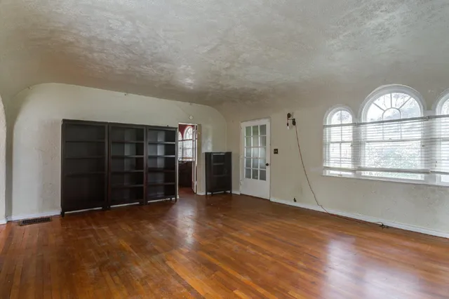 a view of an entryway with wooden floor