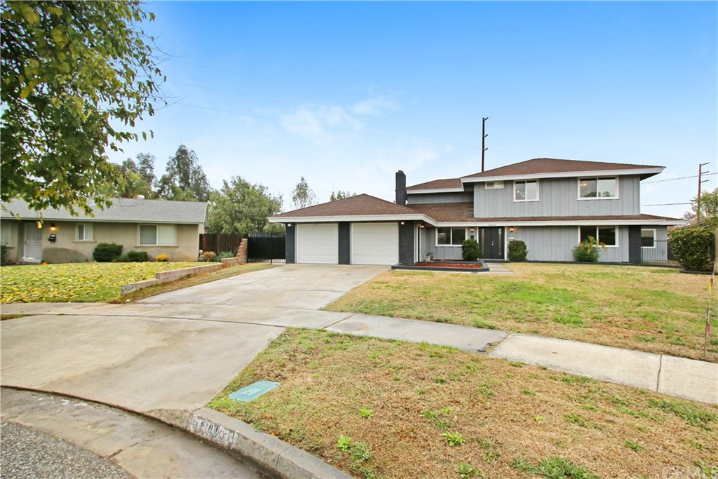 6410 Capistrano Way Riverside, CA 92504 - Photo 1 of 1 a front view of a house with a yard