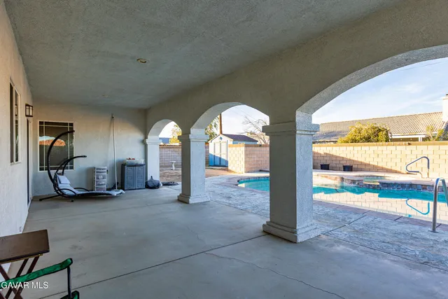 a view of a swimming pool with a patio