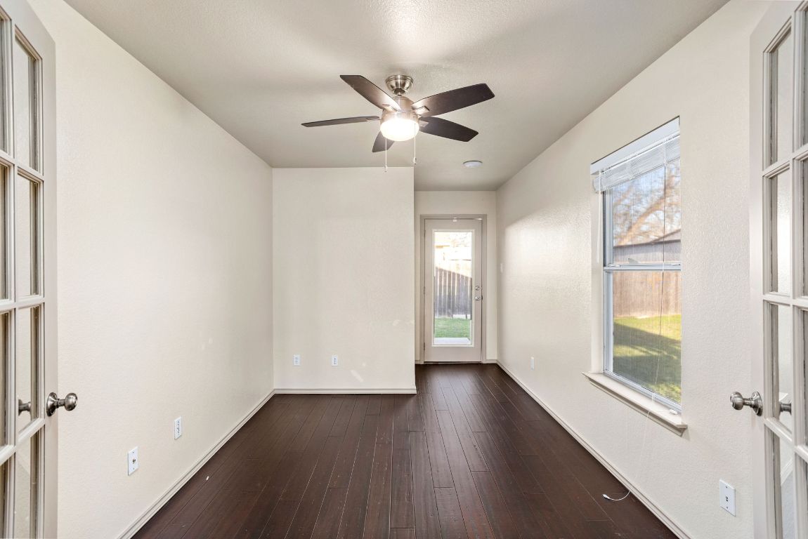 409 Lydia Lane Thrall, TX 76578 - Photo 12 of 39 a view of empty room with wooden floor and fan