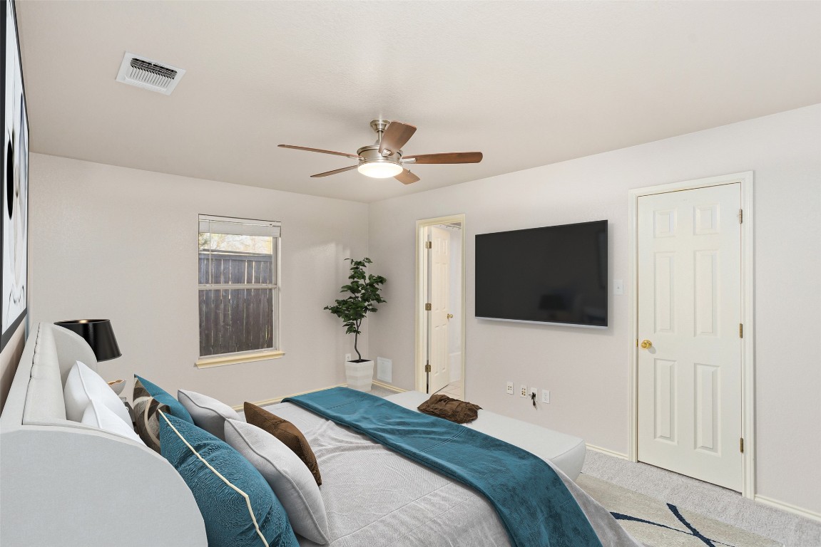 409 Lydia Lane Thrall, TX 76578 - Photo 20 of 39 a bedroom with a bed a window and flat screen television