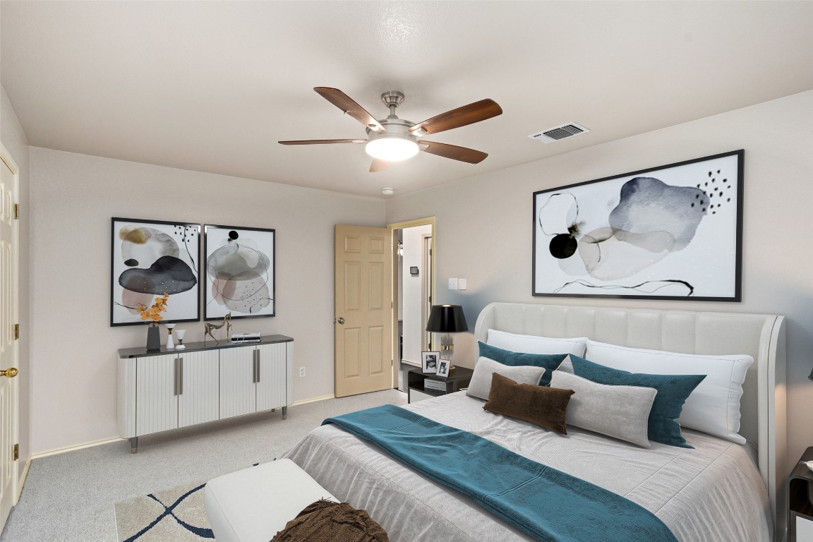 409 Lydia Lane Thrall, TX 76578 - Photo 22 of 39 a bedroom with a bed and a painting on the wall