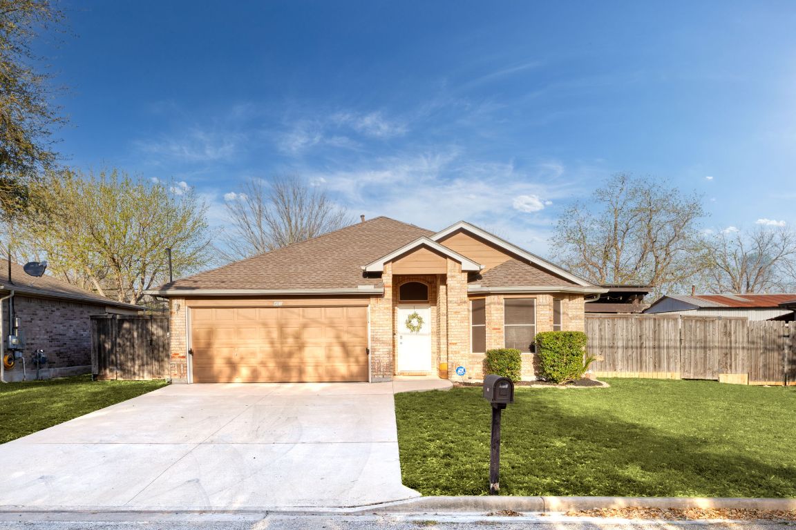 409 Lydia Lane Thrall, TX 76578 - Photo 3 of 39 a front view of a house with a yard