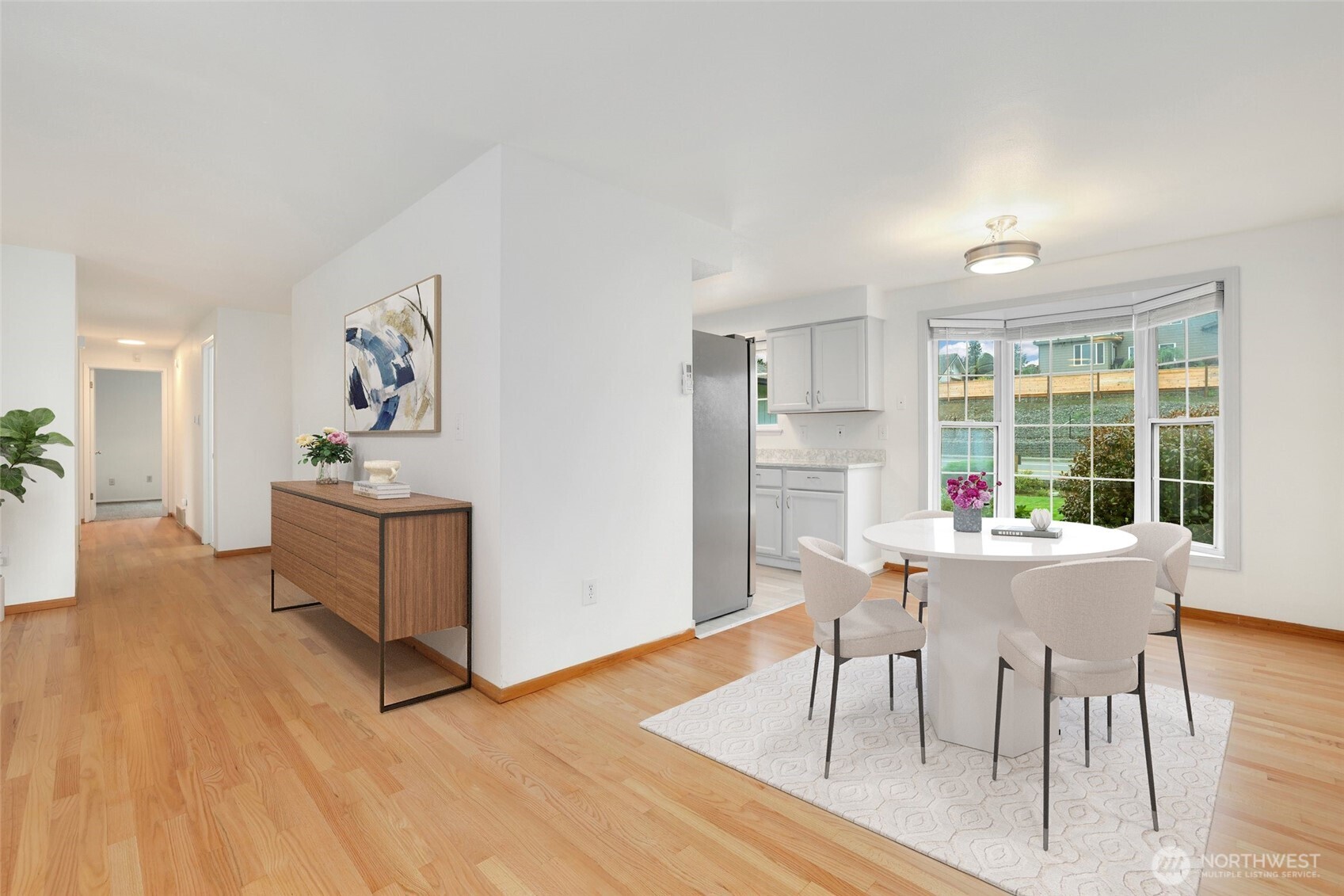 4609 North Vassault Street Tacoma, WA 98407 - Photo 11 of 37 a view of a dining room with furniture window and wooden floor