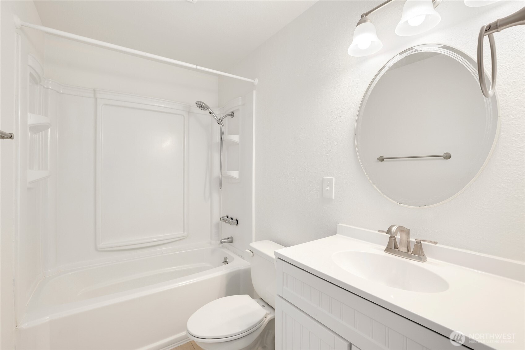 4609 North Vassault Street Tacoma, WA 98407 - Photo 19 of 37 a bathroom with a sink a toilet and a mirror