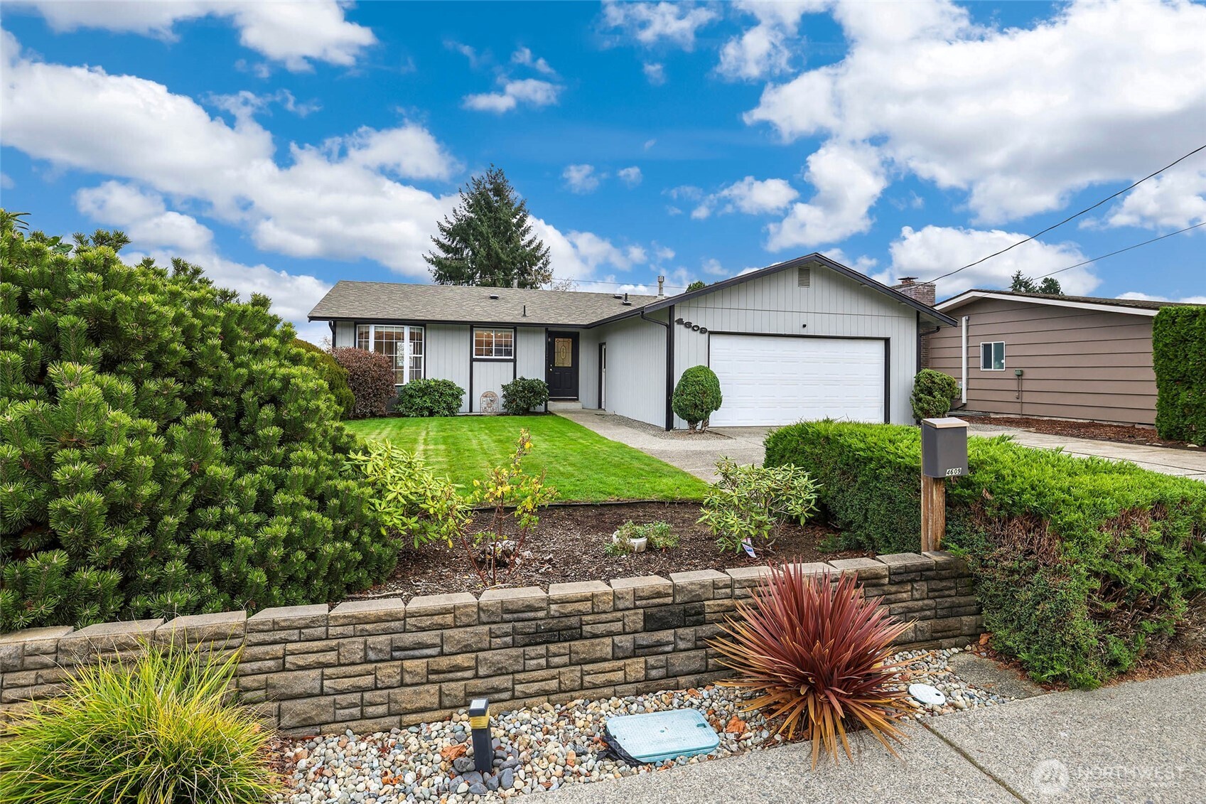 4609 North Vassault Street Tacoma, WA 98407 - Photo 2 of 37 a house view with a garden space