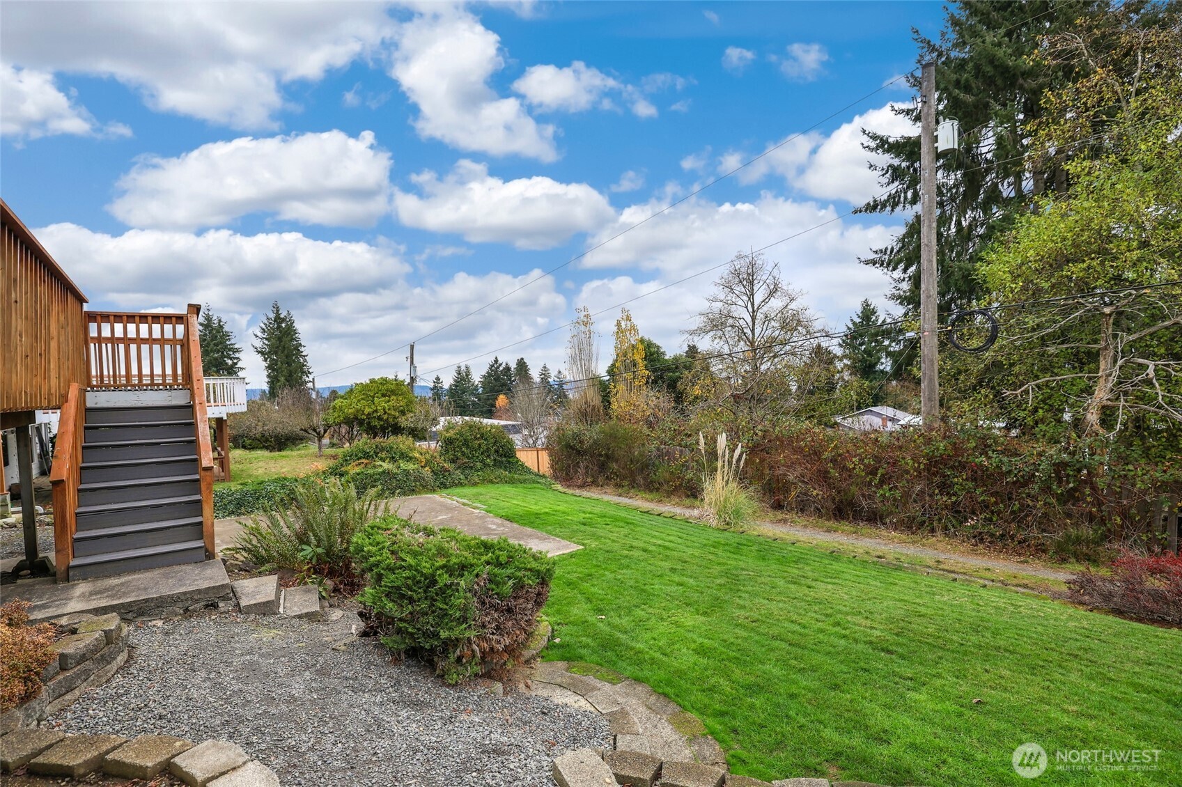 4609 North Vassault Street Tacoma, WA 98407 - Photo 30 of 37 a view of a garden with plants and a bench