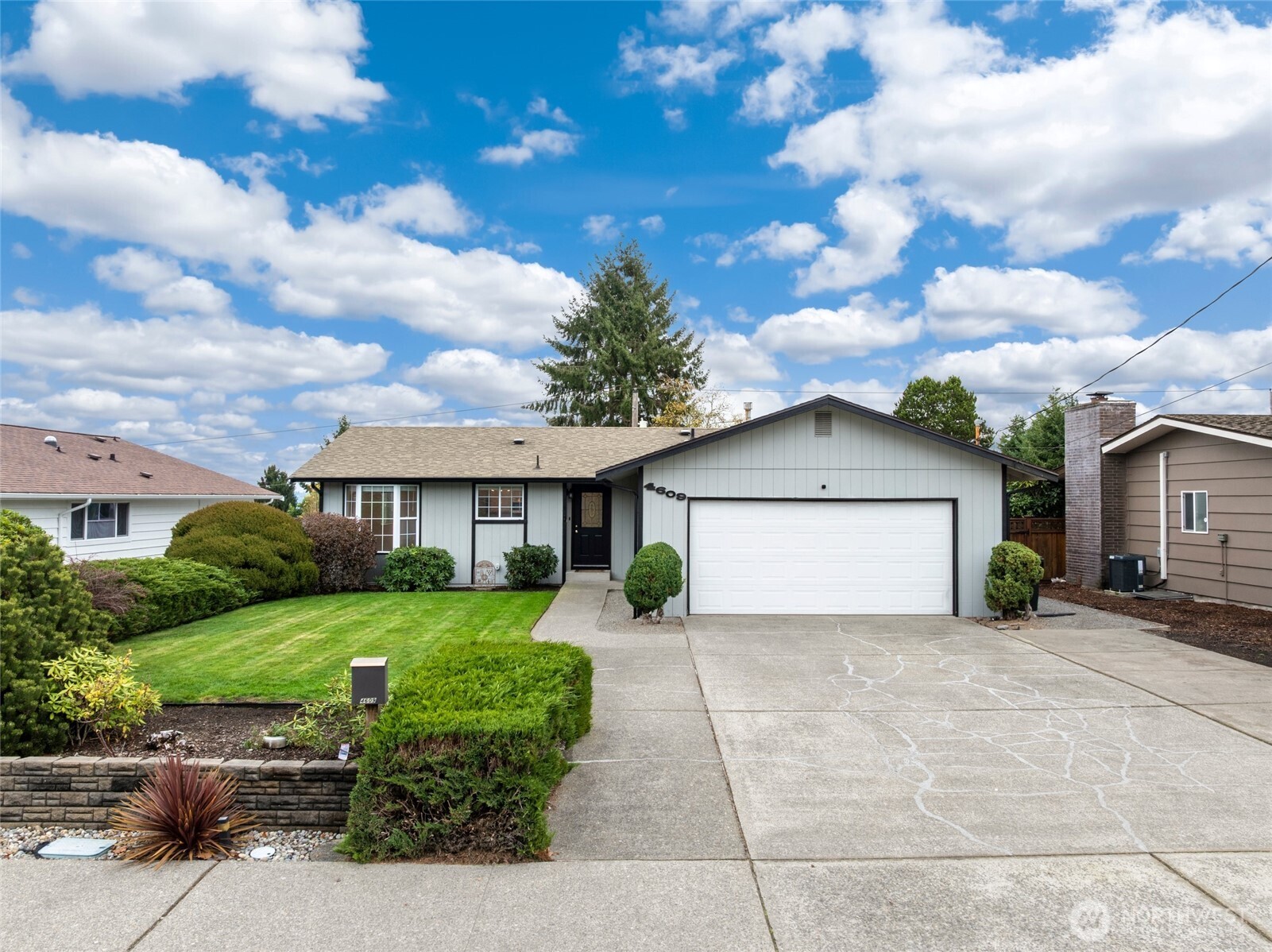 4609 North Vassault Street Tacoma, WA 98407 - Photo 3 of 37 a view of a house with a yard and garage