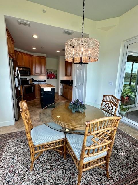 9221 Quartz Lane, Unit 9102 Naples, FL 34120 - Photo 15 of 19 Dining area with baseboards, visible vents, recessed lighting, and an inviting chandelier