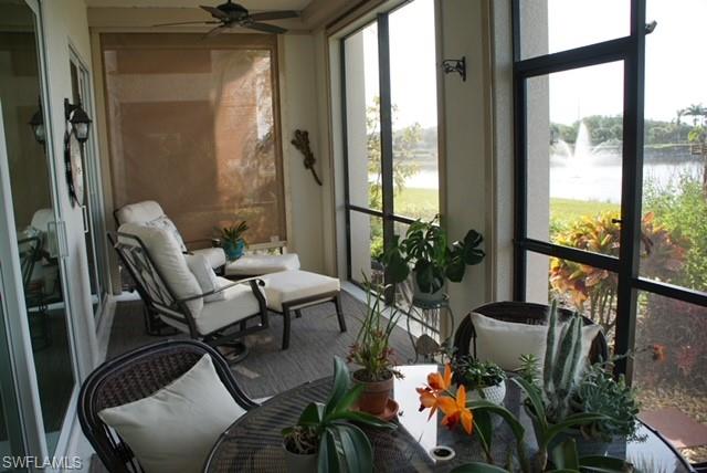 9221 Quartz Lane, Unit 9102 Naples, FL 34120 - Photo 17 of 19 Sunroom / solarium featuring a water view, a ceiling fan, and plenty of natural light