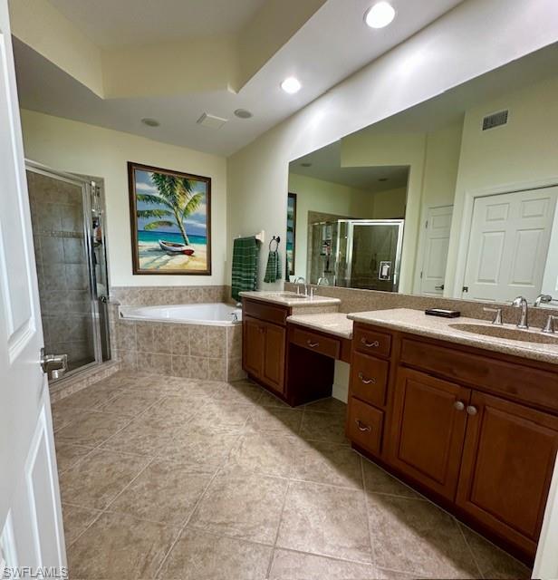 9221 Quartz Lane, Unit 9102 Naples, FL 34120 - Photo 9 of 19 Bathroom featuring a stall shower, vanity, tile patterned flooring, a bath, and visible vents