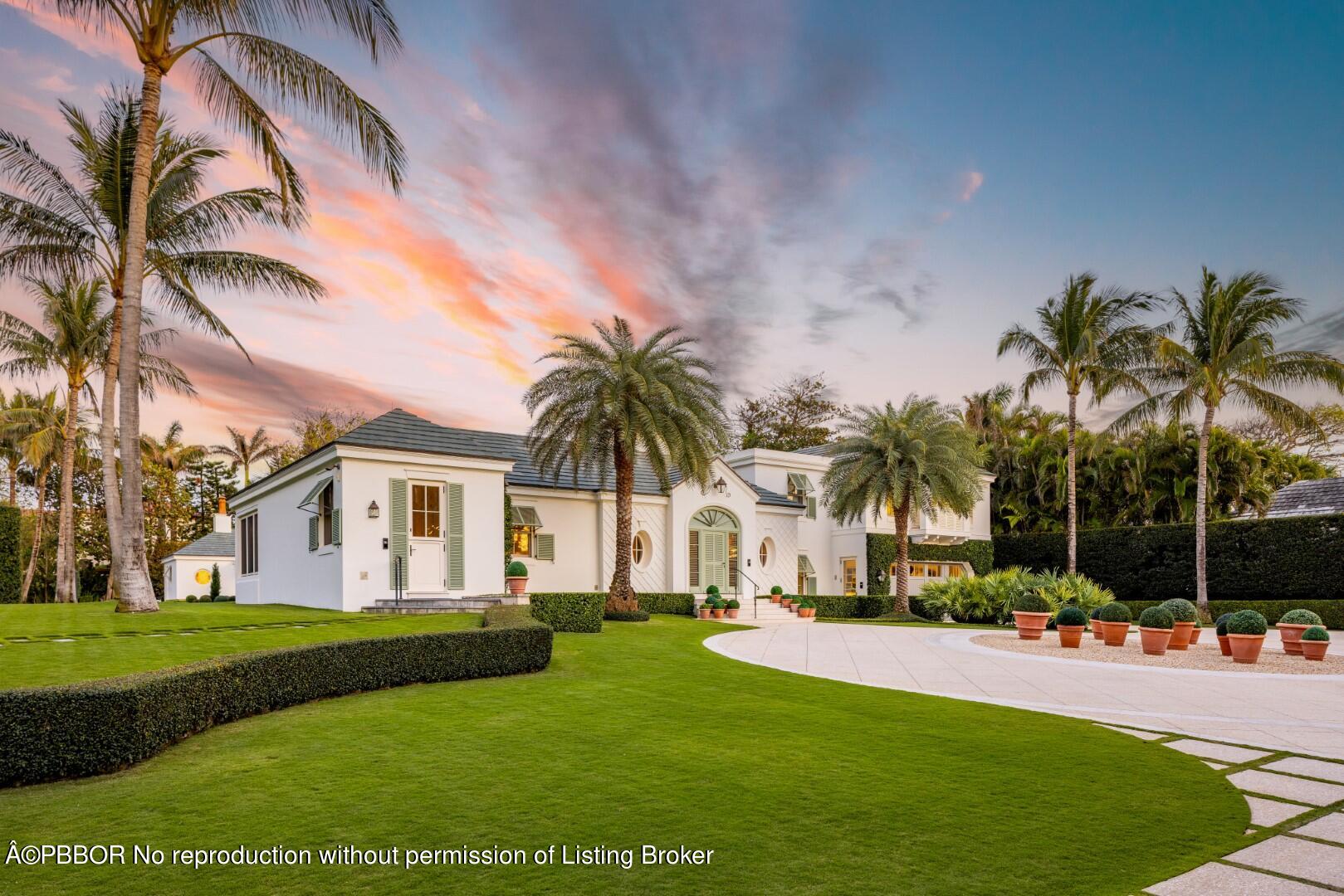 710 South County Road Palm Beach, FL 33480 - Photo 2 of 69 a view of a white house with a big yard and potted plants