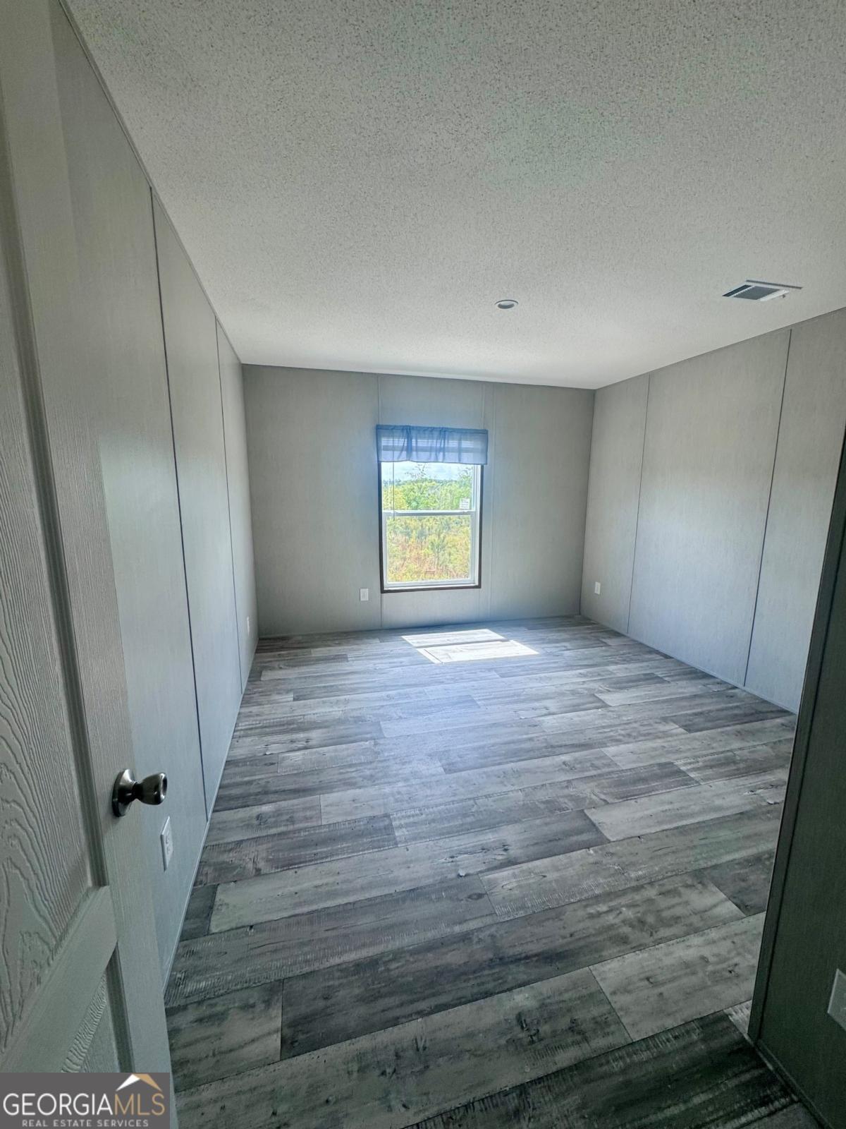 67 Long Leaf Road Hazlehurst, GA 31539 - Photo 12 of 17 a view of an empty room with a window