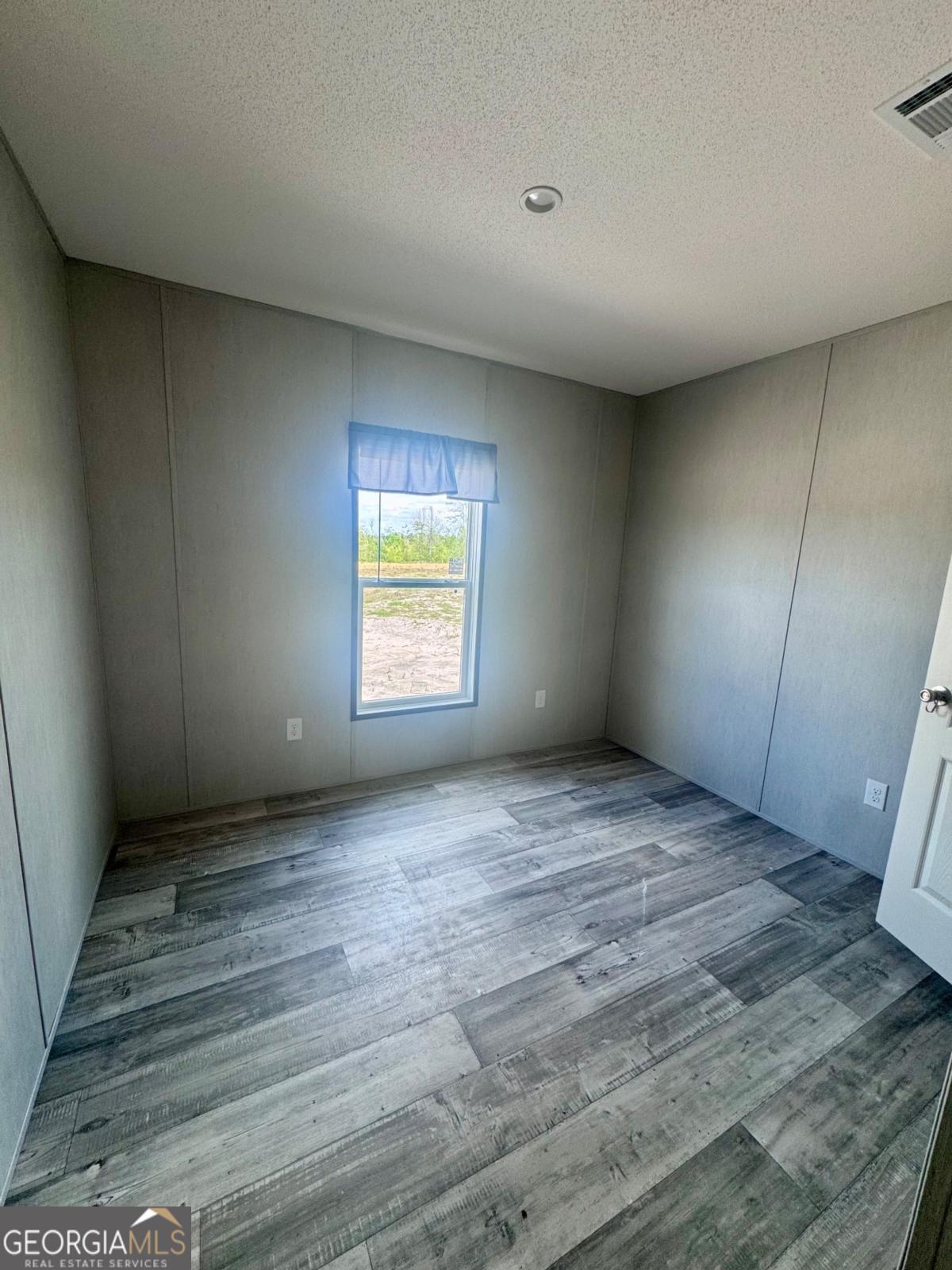 67 Long Leaf Road Hazlehurst, GA 31539 - Photo 14 of 17 a view of an empty room with a window