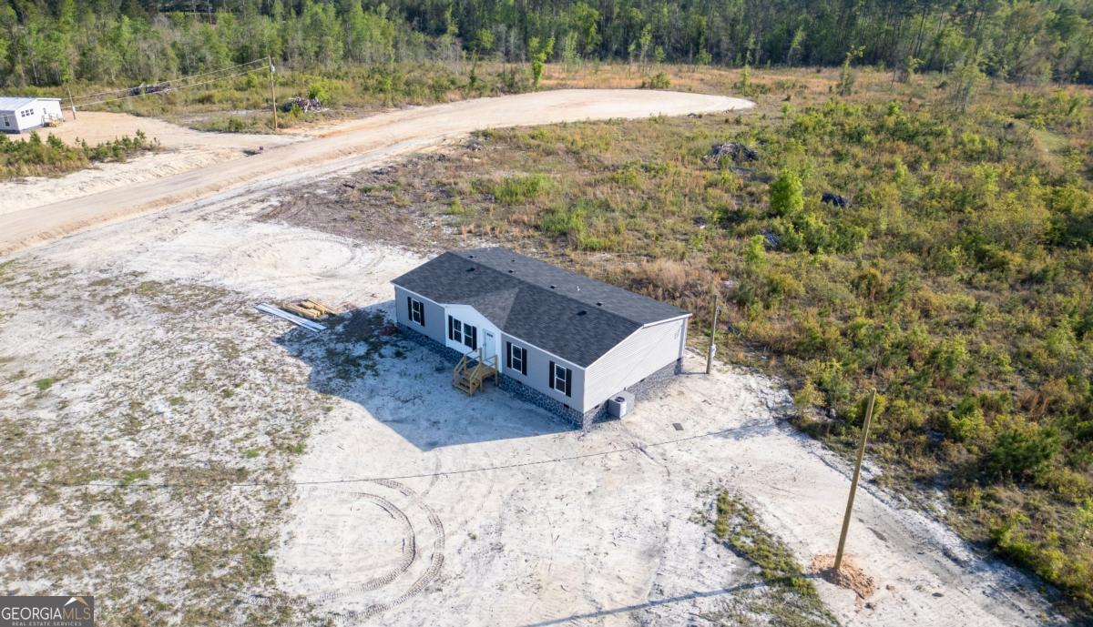 67 Long Leaf Road Hazlehurst, GA 31539 - Photo 17 of 17 a view of a yard with a yard