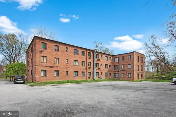 a front view of a building with garden