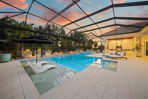 a view of a swimming pool with a patio