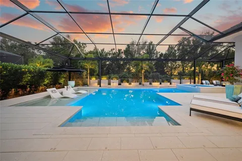 a living room with furniture a rug and a flat screen tv