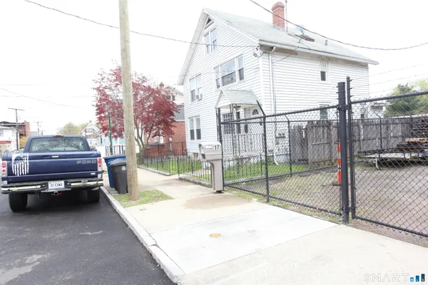 a view of a back yard of the house