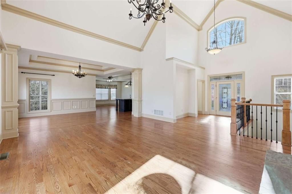 5264 Laurel Circle Gainesville, GA 30506 - Photo 11 of 47 a view of a livingroom with furniture wooden floor windows and a chandelier