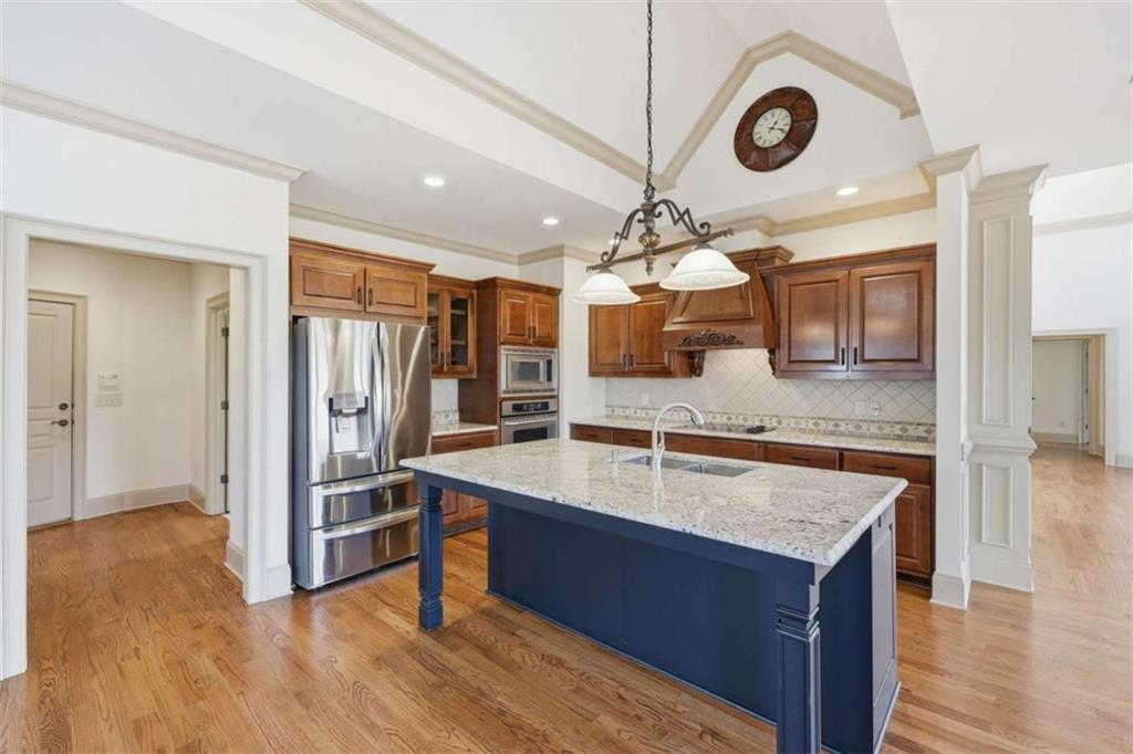 5264 Laurel Circle Gainesville, GA 30506 - Photo 14 of 47 a large kitchen with a counter space a sink and stainless steel appliances