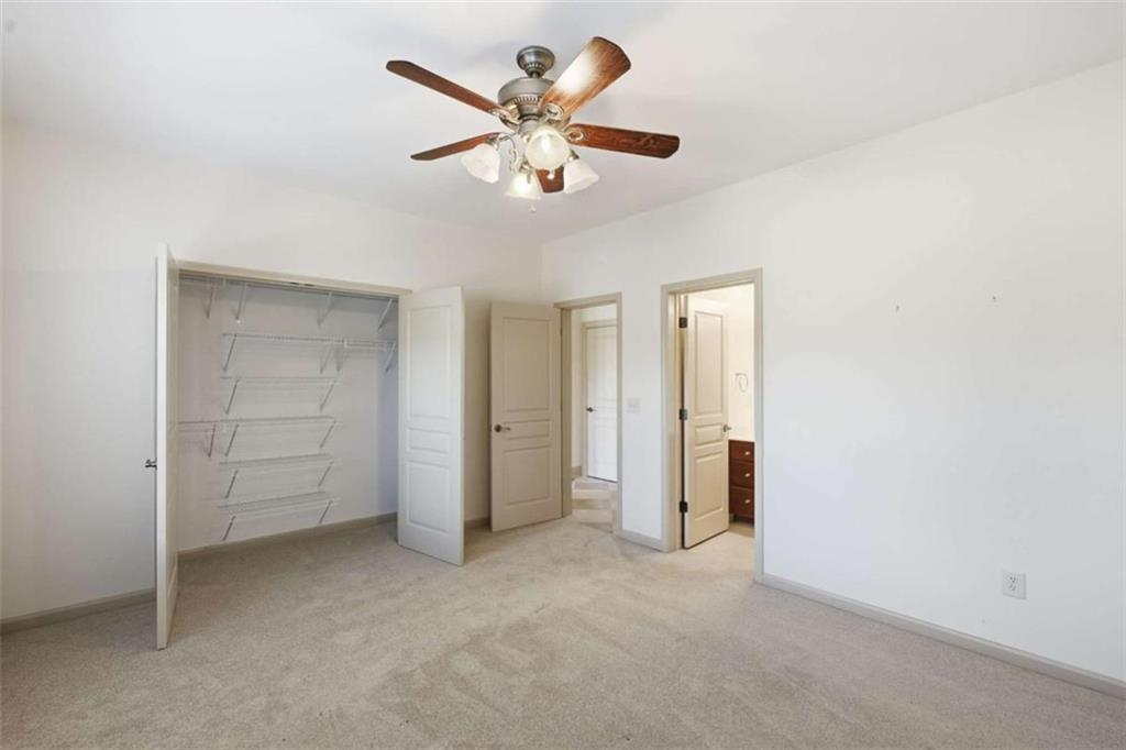5264 Laurel Circle Gainesville, GA 30506 - Photo 30 of 47 an empty room with closet and ceiling fan