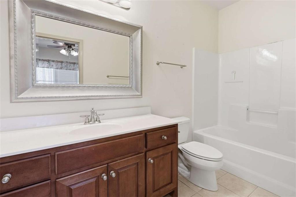 5264 Laurel Circle Gainesville, GA 30506 - Photo 31 of 47 a bathroom with a sink a toilet and shower