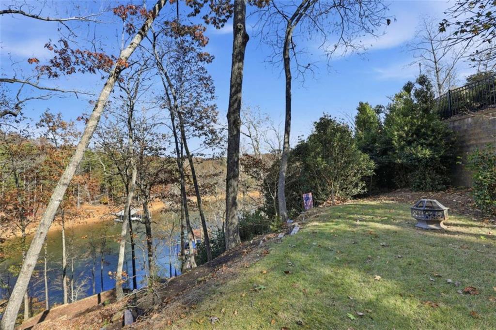 5264 Laurel Circle Gainesville, GA 30506 - Photo 34 of 47 a backyard of a house with a yard and outdoor seating