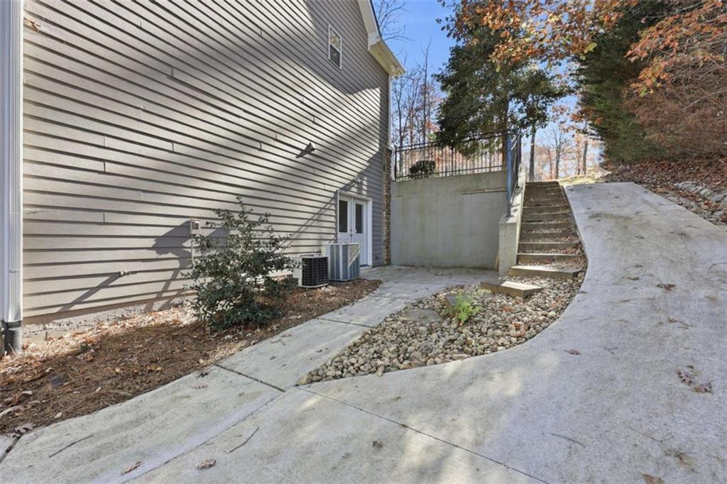 5264 Laurel Circle Gainesville, GA 30506 - Photo 42 of 47 a view of a pathway of a house with wooden fence