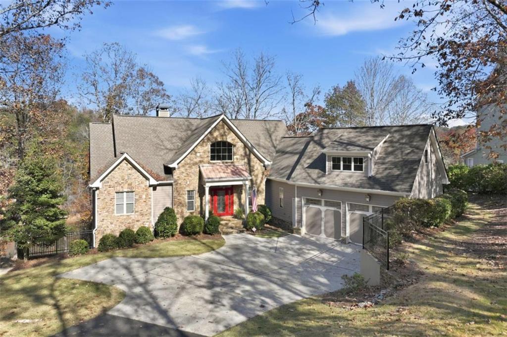 5264 Laurel Circle Gainesville, GA 30506 - Photo 47 of 47 a view of a white house with a yard and large trees