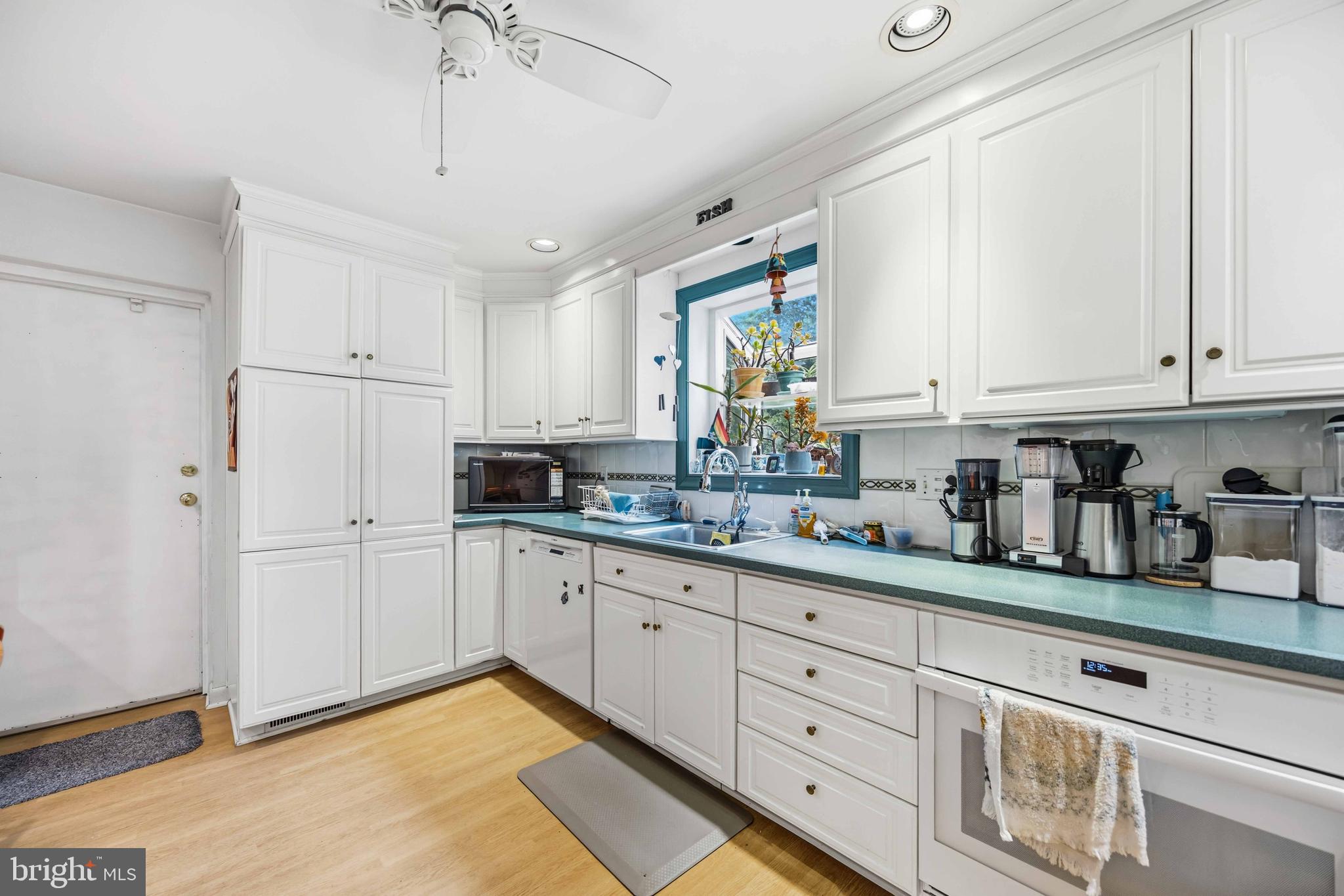 330 Bent Road Wyncote, PA 19095 - Photo 15 of 47 a kitchen with granite countertop white cabinets and white appliances