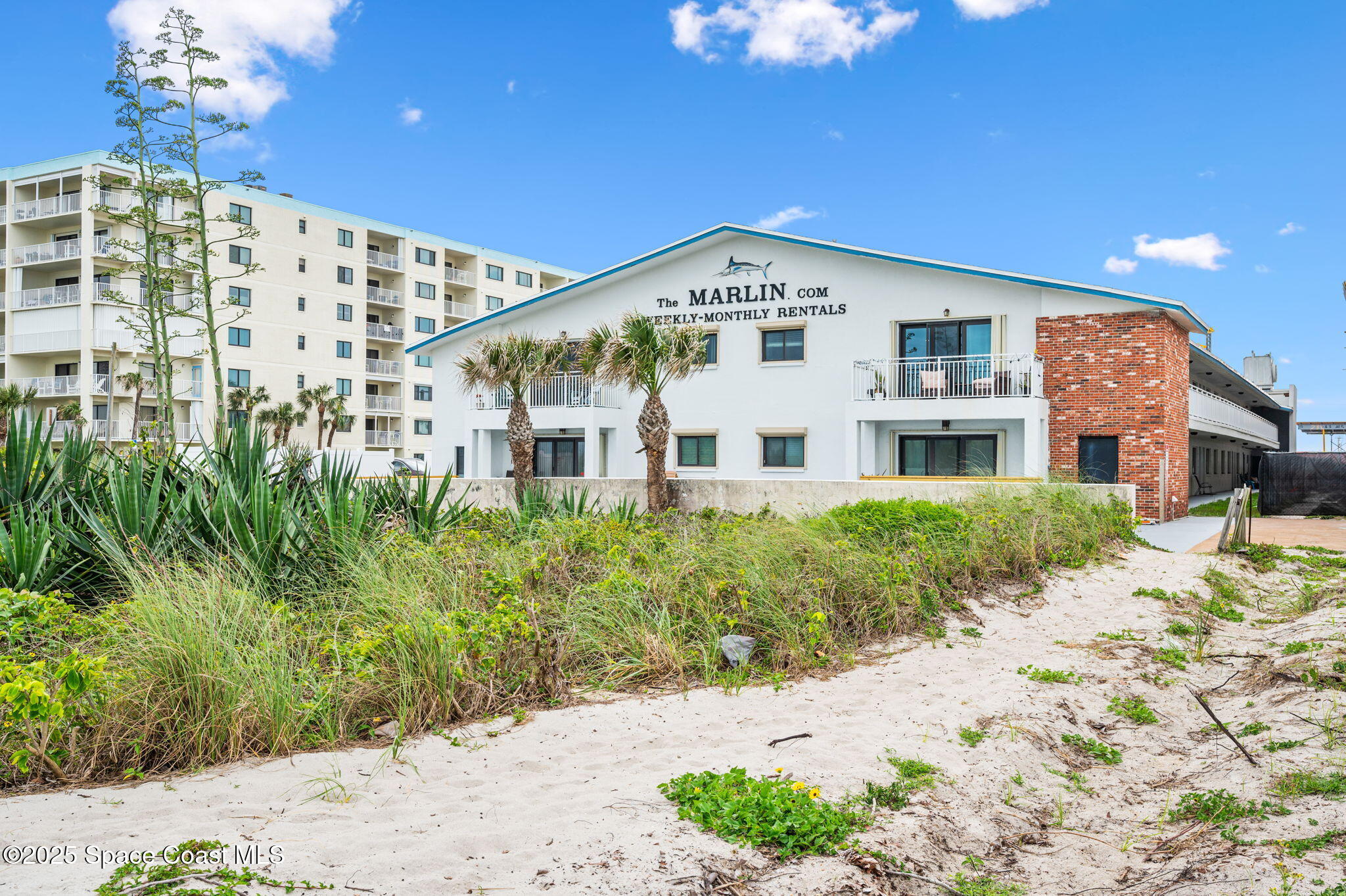 Undisclosed Address Cocoa Beach, FL 32931 - Photo 22 of 23 a view of white house with a yard
