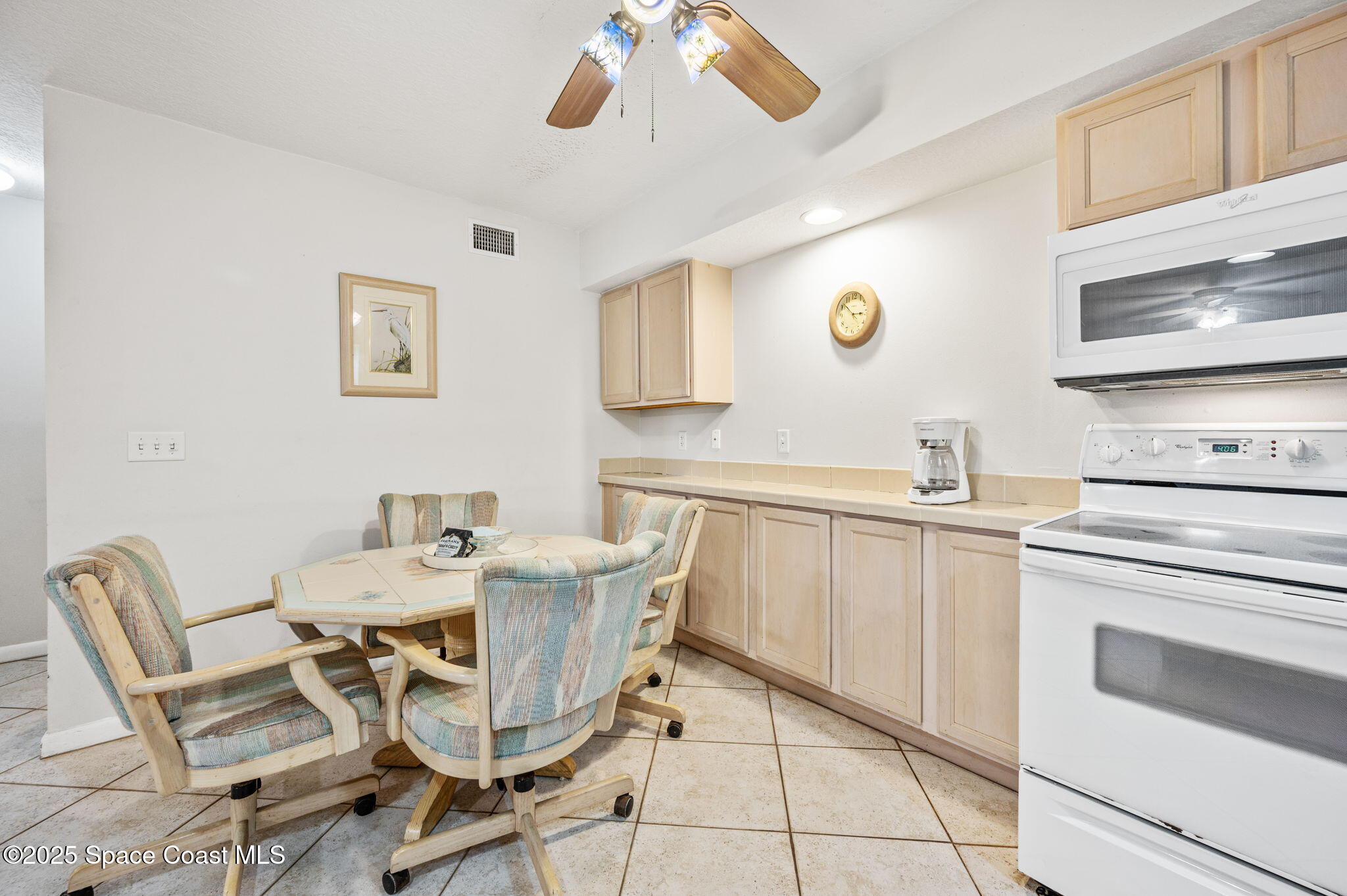 Undisclosed Address Cocoa Beach, FL 32931 - Photo 10 of 23 a kitchen with stainless steel appliances kitchen island granite countertop a sink and cabinets