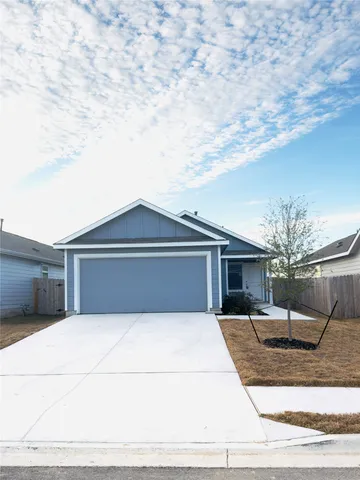 a front view of a house with yard
