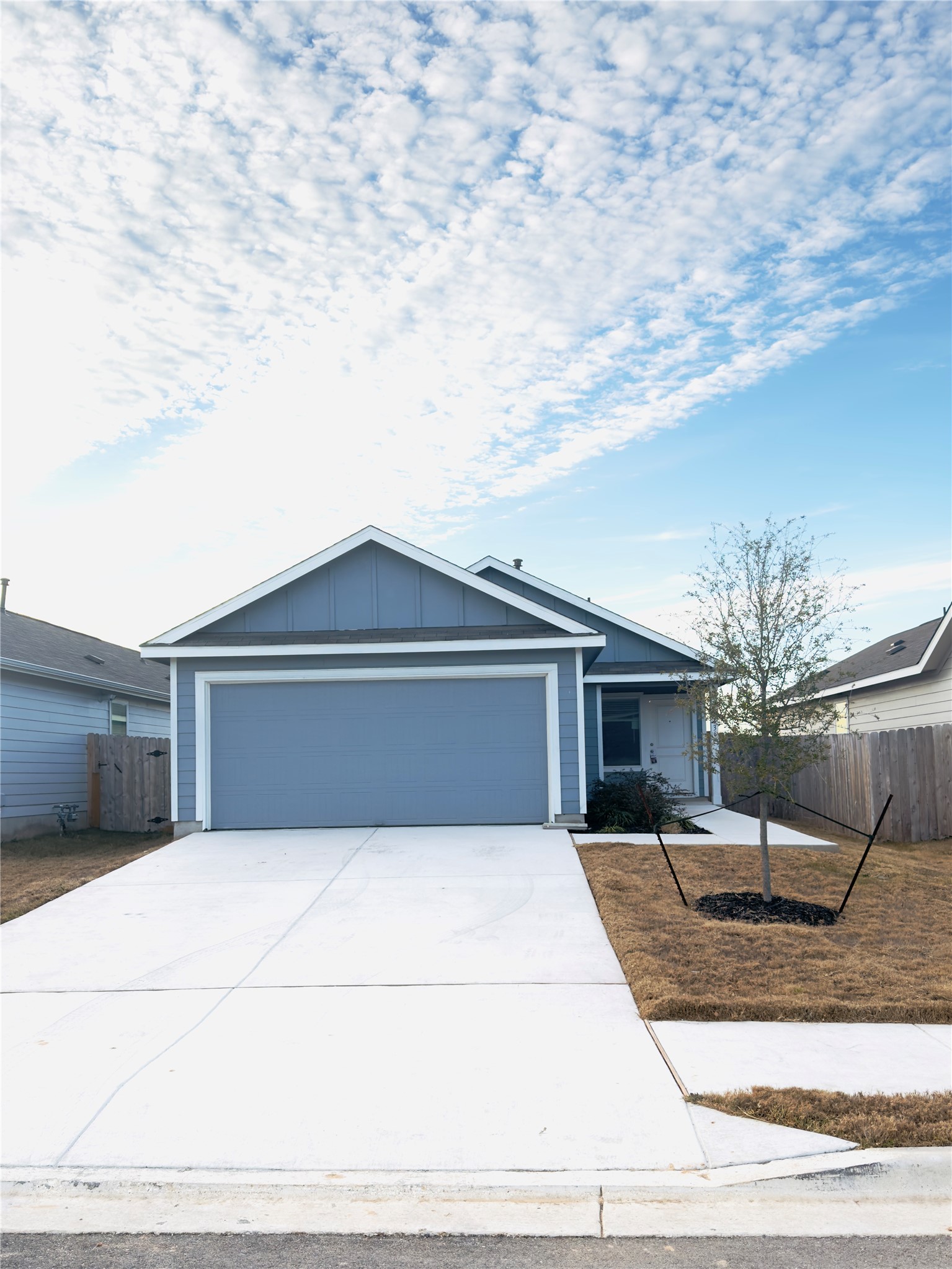 a front view of a house with yard