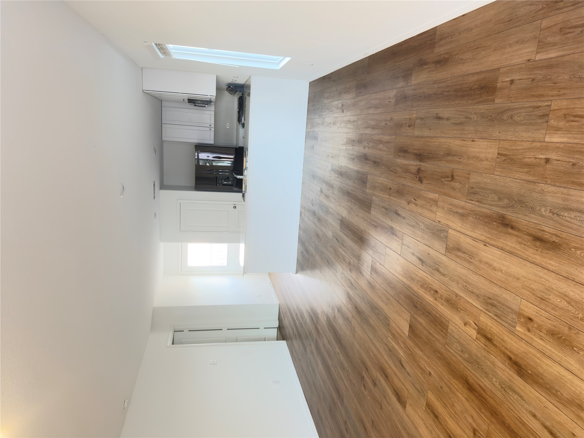 13336 Illumination Road Elgin, TX 78621 - Photo 12 of 15 a view of a kitchen with wooden floor and a sink