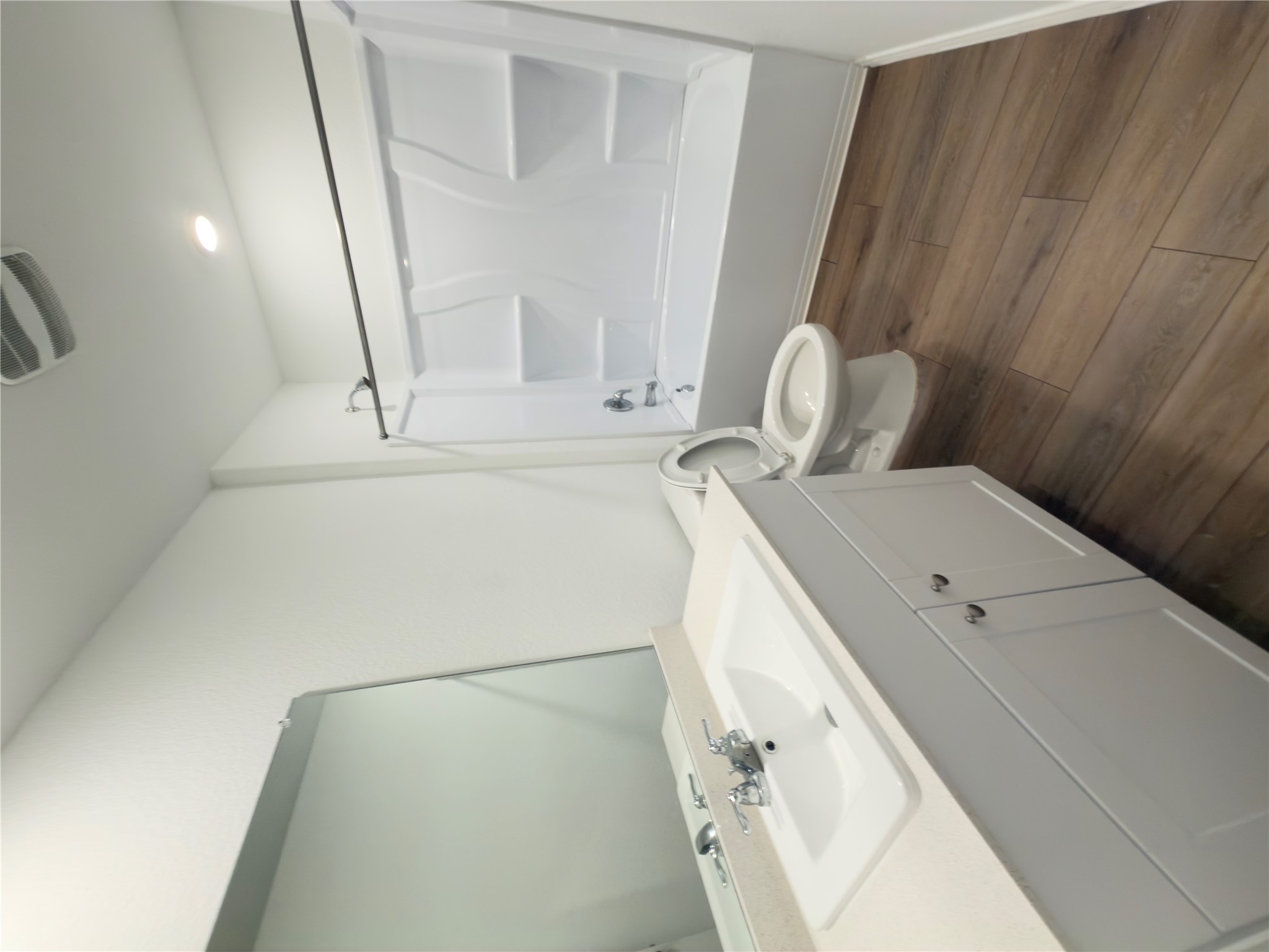 13336 Illumination Road Elgin, TX 78621 - Photo 5 of 15 a bathroom with a double vanity sink toilet and shower