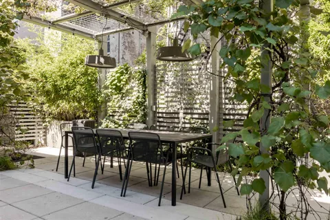 a view of a chairs and table in a patio