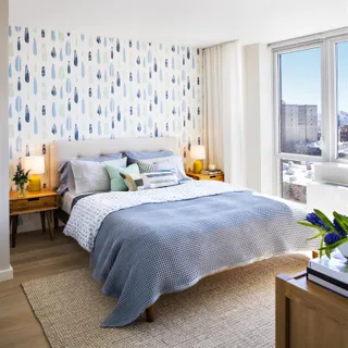 a bedroom with a bed and window