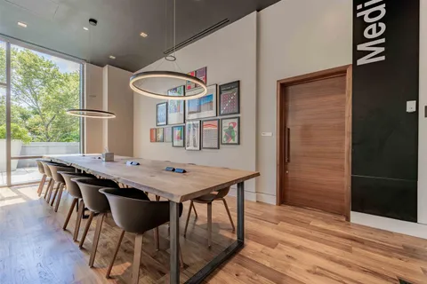 a view of a dining room with furniture window and wooden floor