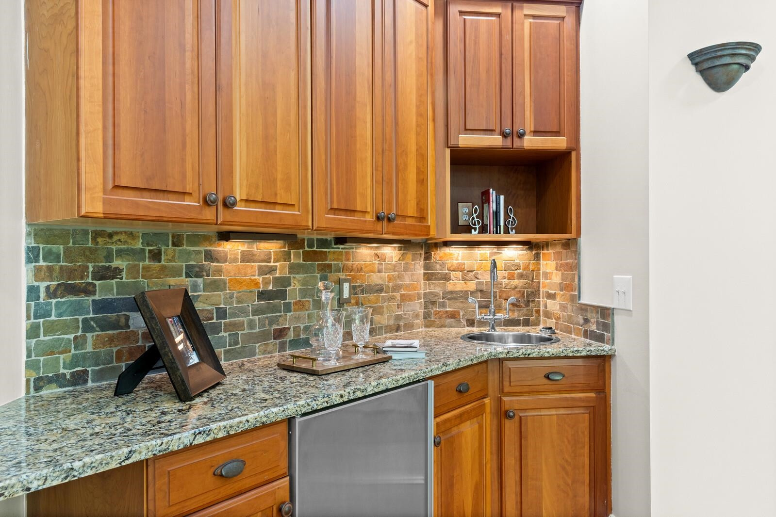 6620 Rest Haven Drive Raleigh, NC 27612 - Photo 45 of 52 Wet bar features granite countertops sink and mini frig