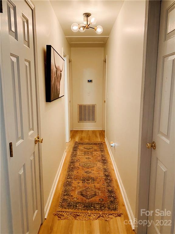 4841 Old Hickory Road Lancaster, SC 29720 - Photo 16 of 17 a view of a hallway with wooden floor and staircase