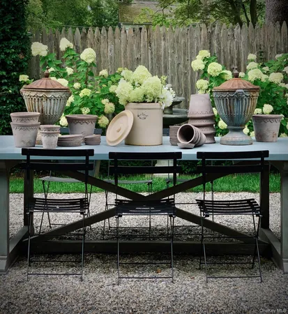 a view of a chairs and table in backyard
