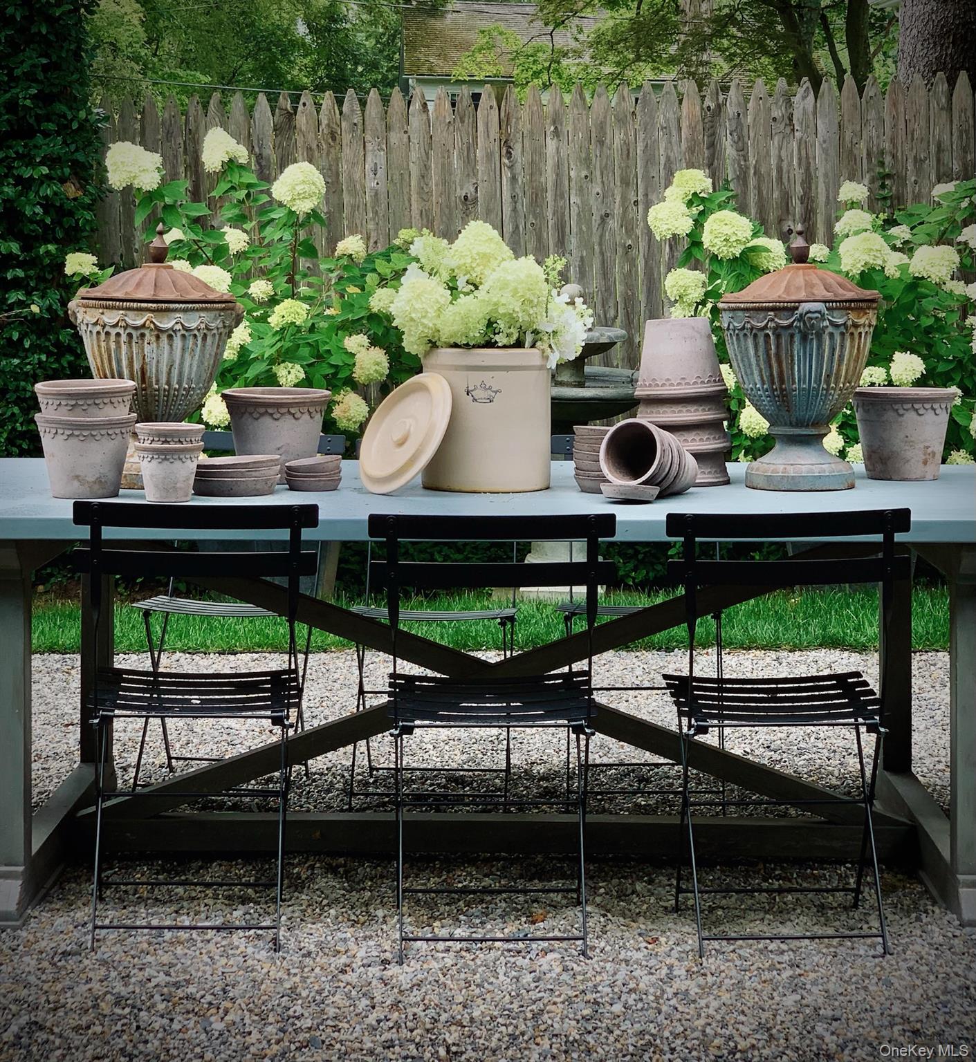 259 Westchester Avenue Pound Ridge, NY 10576 - Photo 5 of 21 a view of a chairs and table in backyard