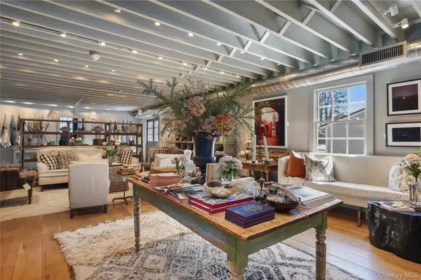 a living room with furniture and a table