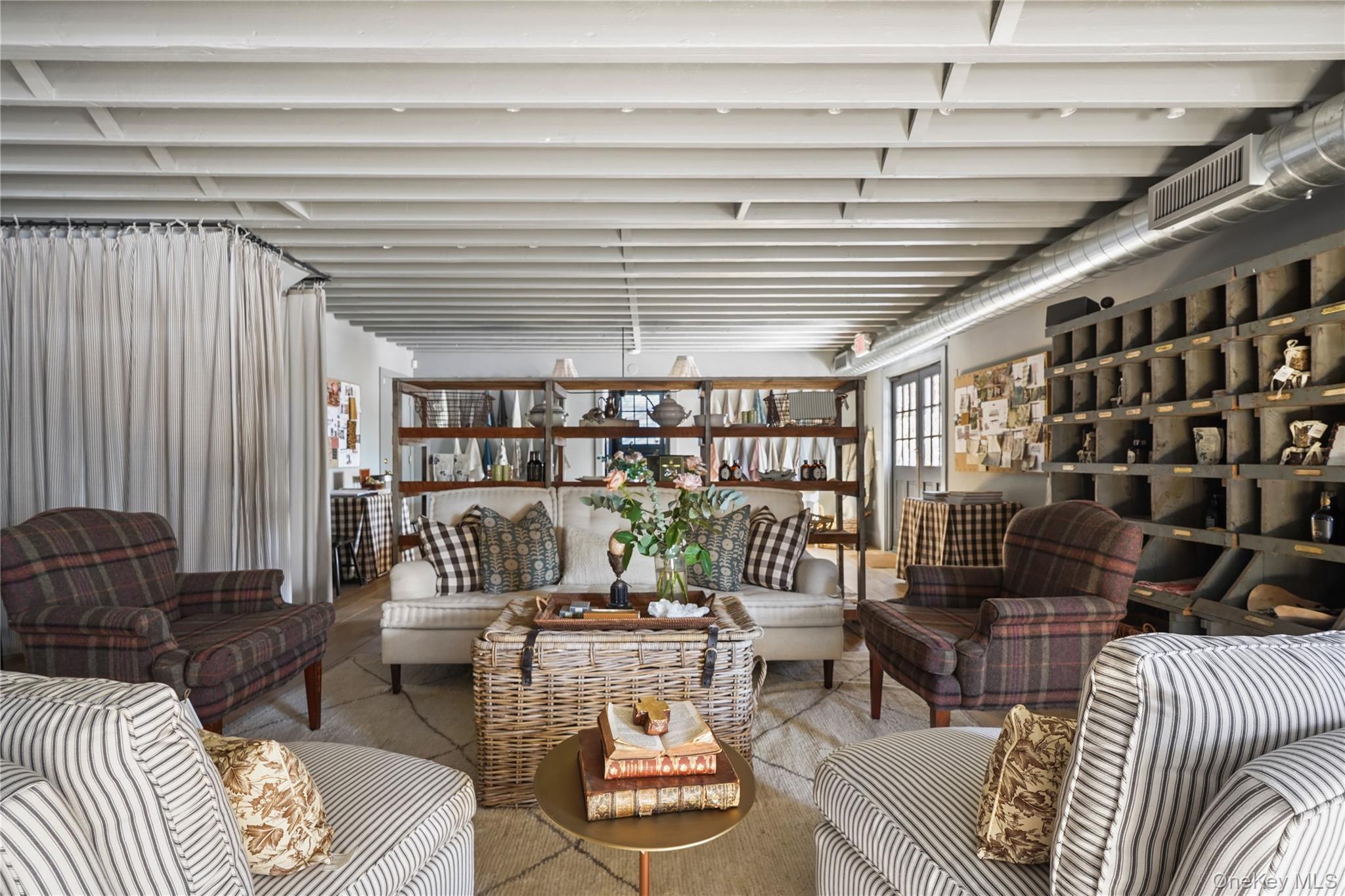 259 Westchester Avenue Pound Ridge, NY 10576 - Photo 9 of 21 a living room with furniture and a book shelf