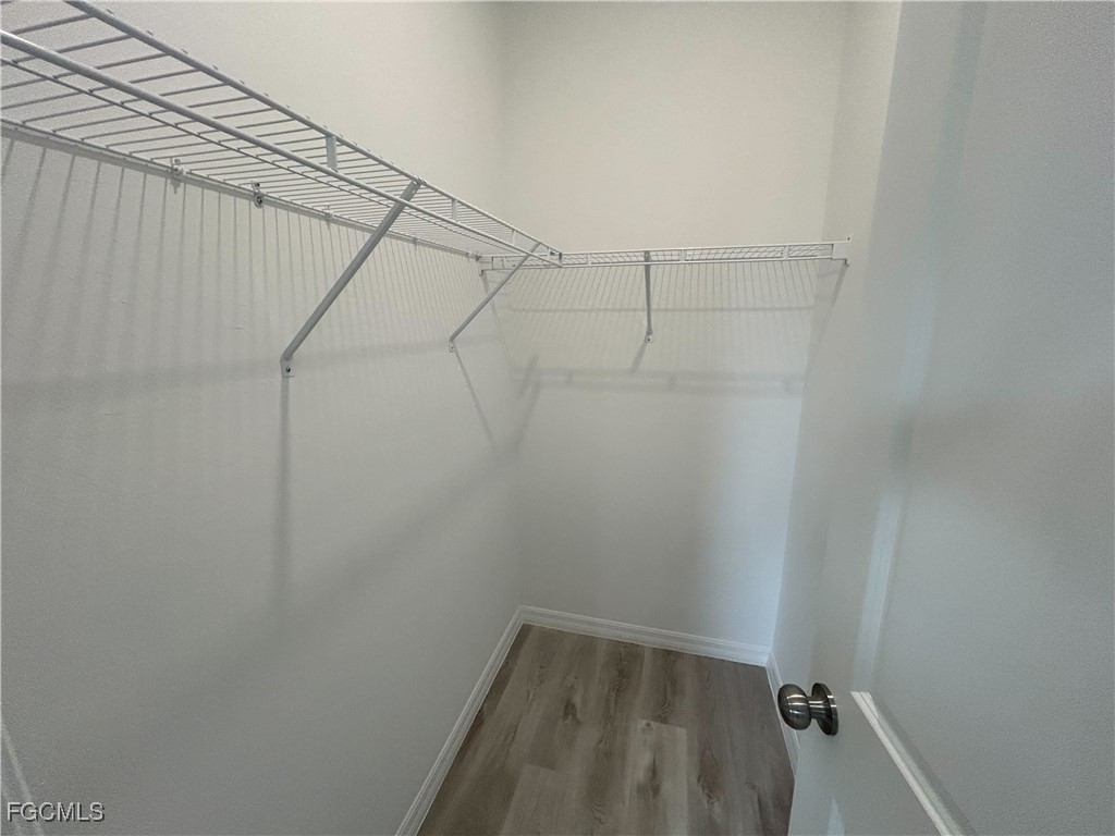 449 Bell Boulevard Lehigh Acres, FL 33974 - Photo 17 of 21 a view of a room with racks on the wall