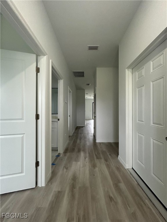 449 Bell Boulevard Lehigh Acres, FL 33974 - Photo 21 of 21 a view of hallway with wooden floor